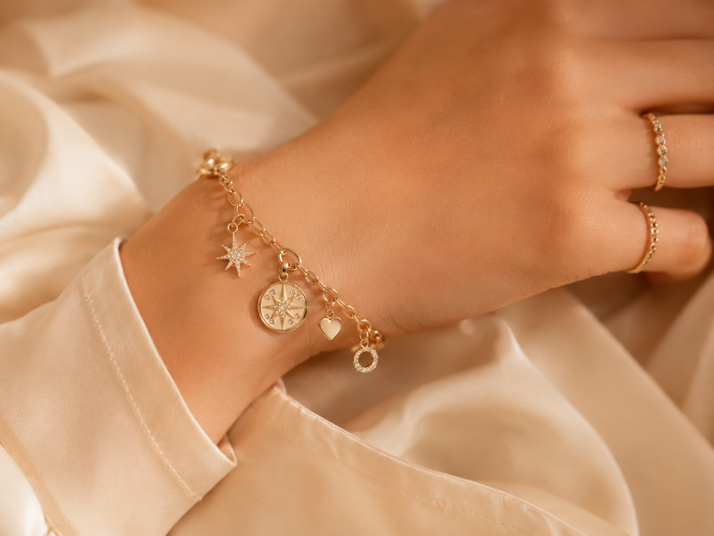 Gold charms on ivory silk