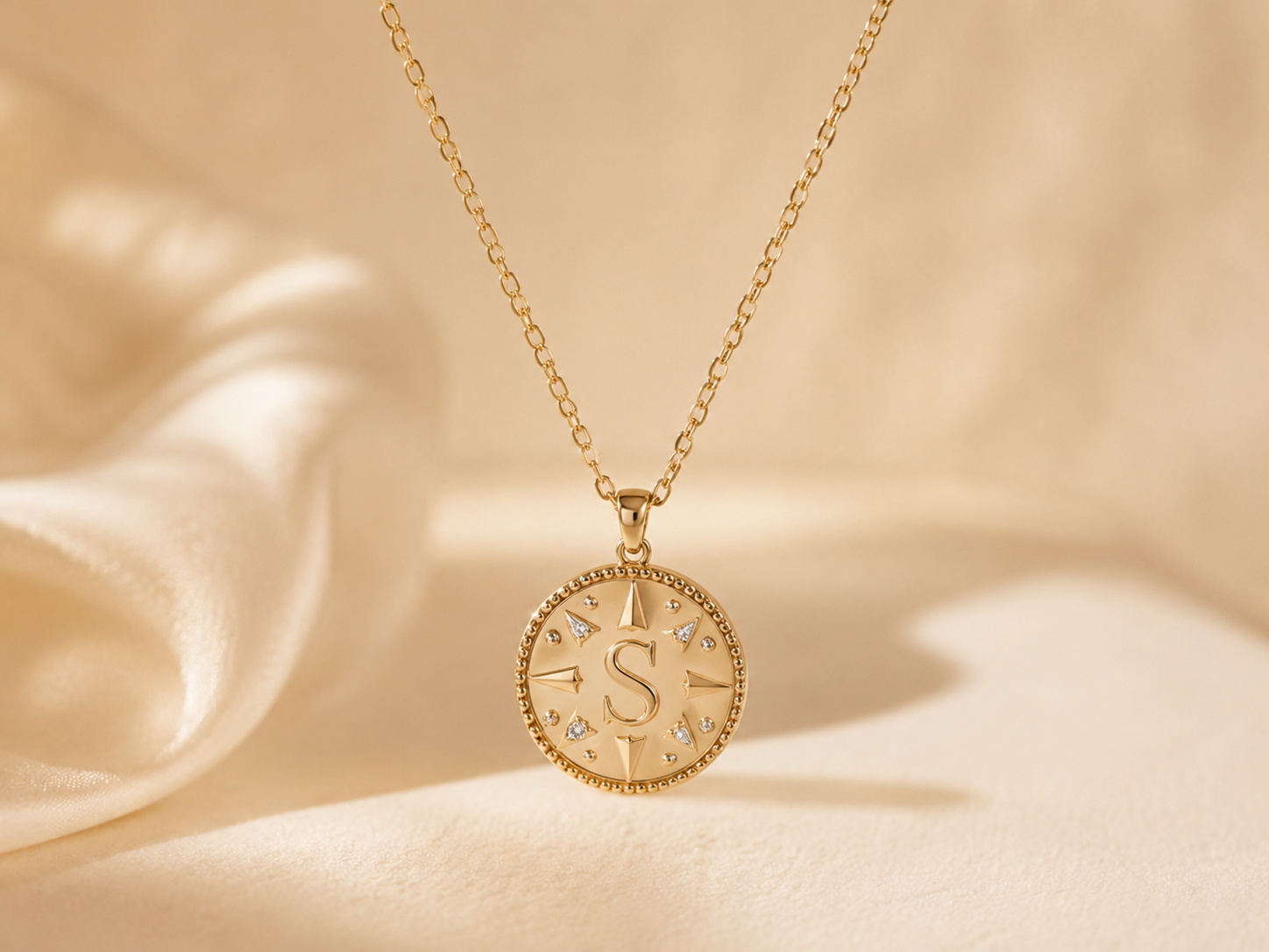 Gold starburst pendant