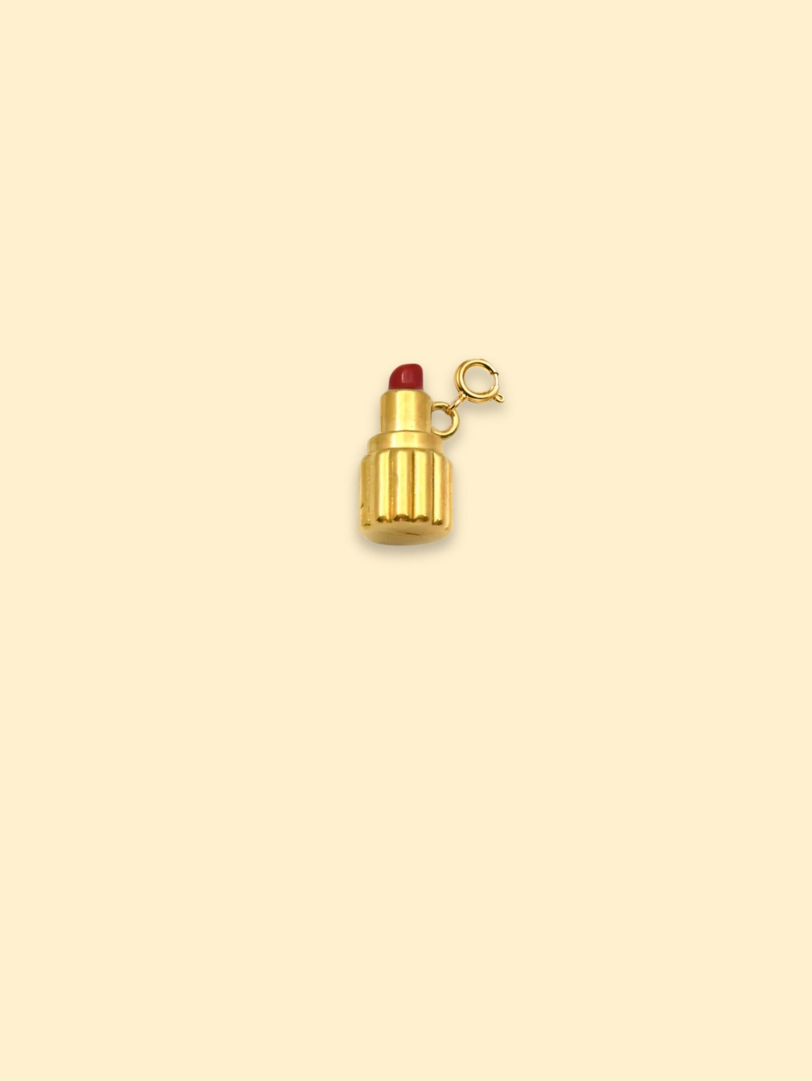 D4541387-9DEE-4D8E-BF44-B919AF874E2D-1 18K Gold Plated Stainless Steel Lipstick Charm Pendant. - Image 1