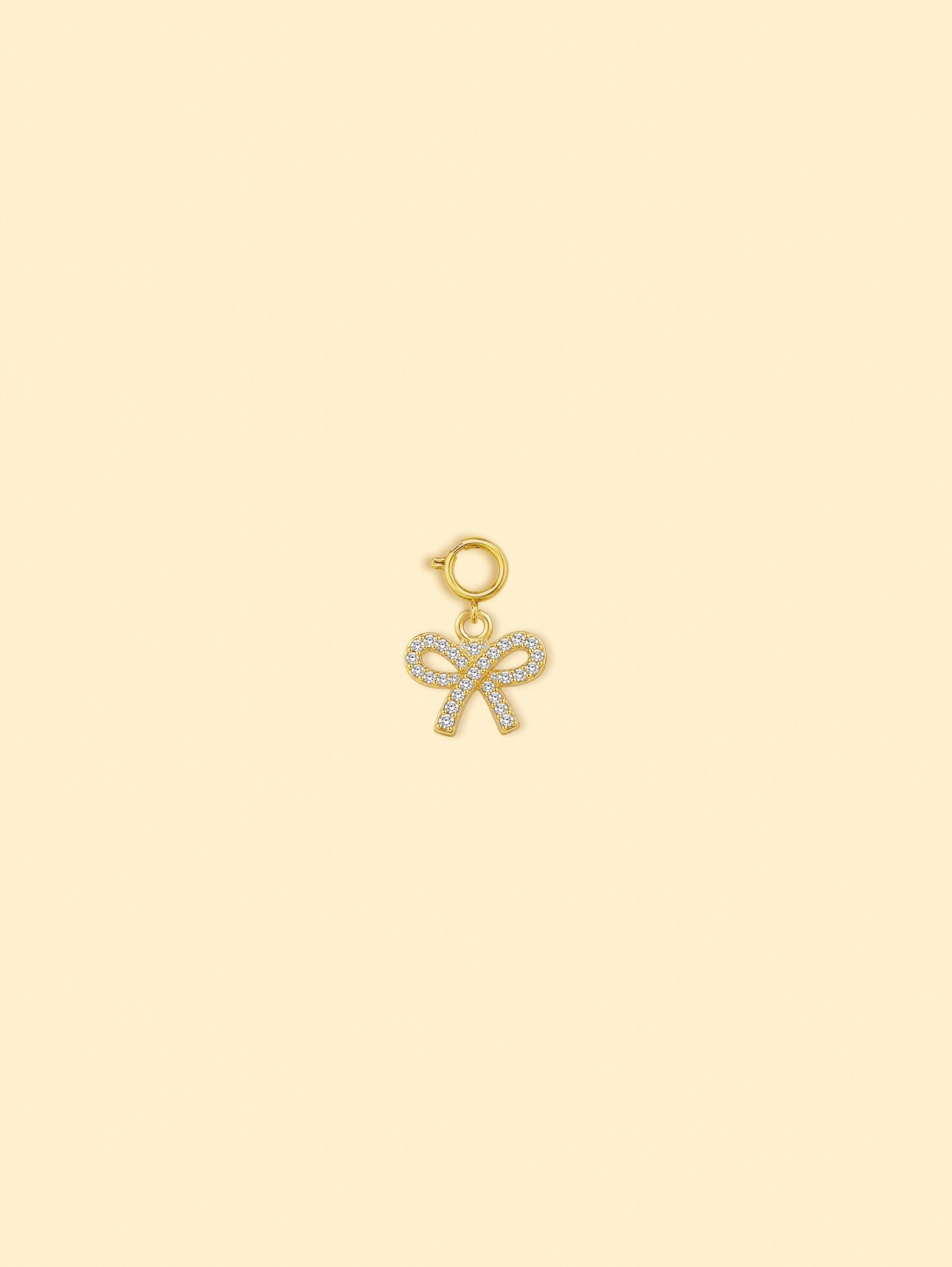 rn-image_picker_lib_temp_2ec8d634-b777-4723-9af1-e949568de68d-1 14K Gold Plated Copper Bow Charm. - Image 1