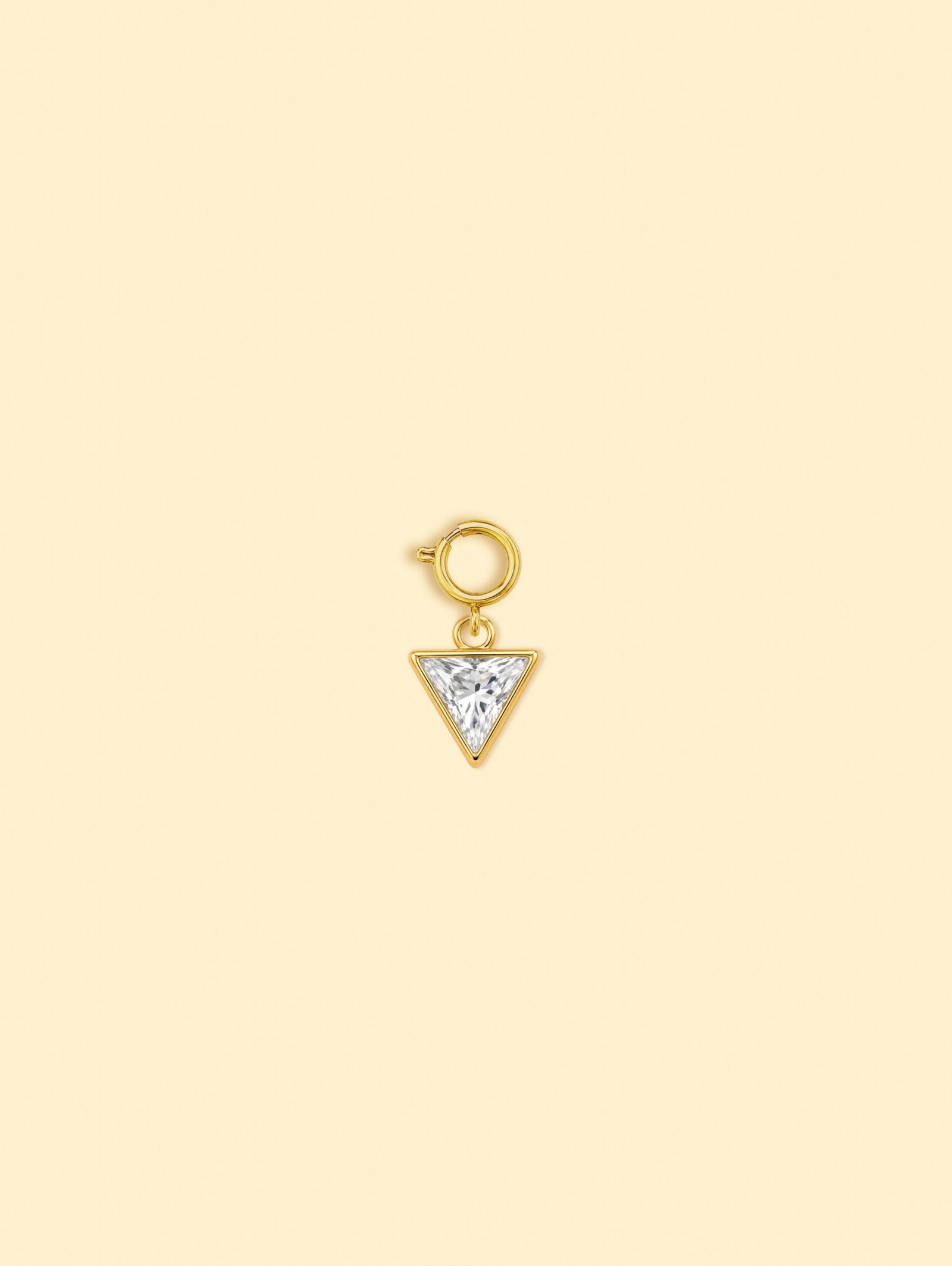 rn-image_picker_lib_temp_e3ebfd0b-319c-4773-a9d1-a07c64fde723-1 18K Gold Plated Stainless Steel Triangle Zircon Charm. - Image 1